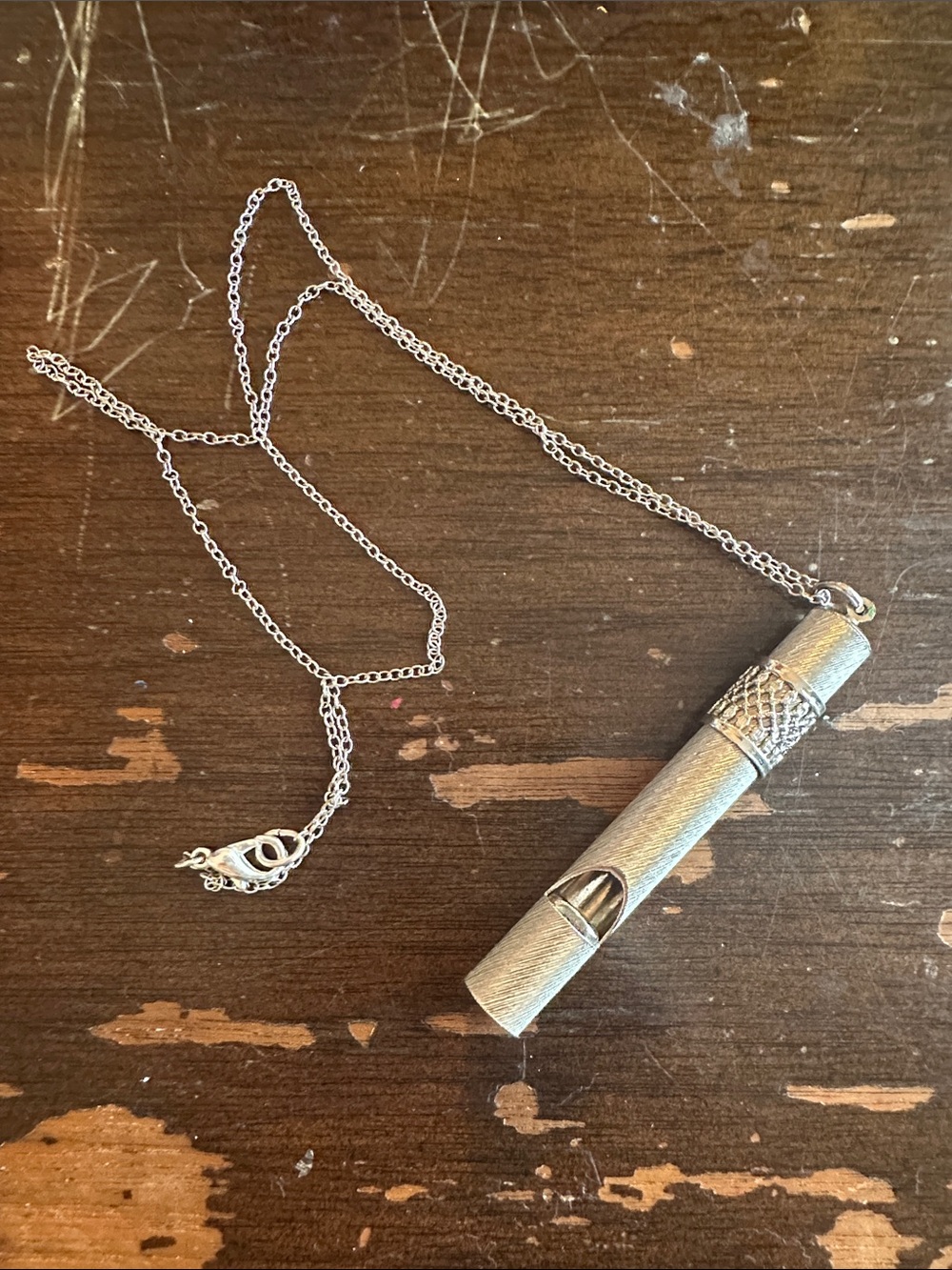 modern silver tone safety whistle, useful and pretty and very very loud